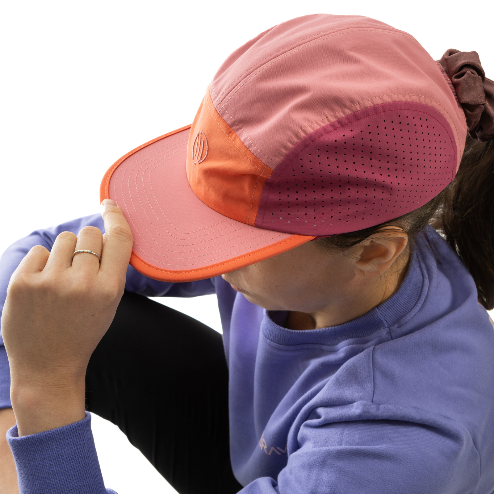 Person wearing a colorful cap with a white background